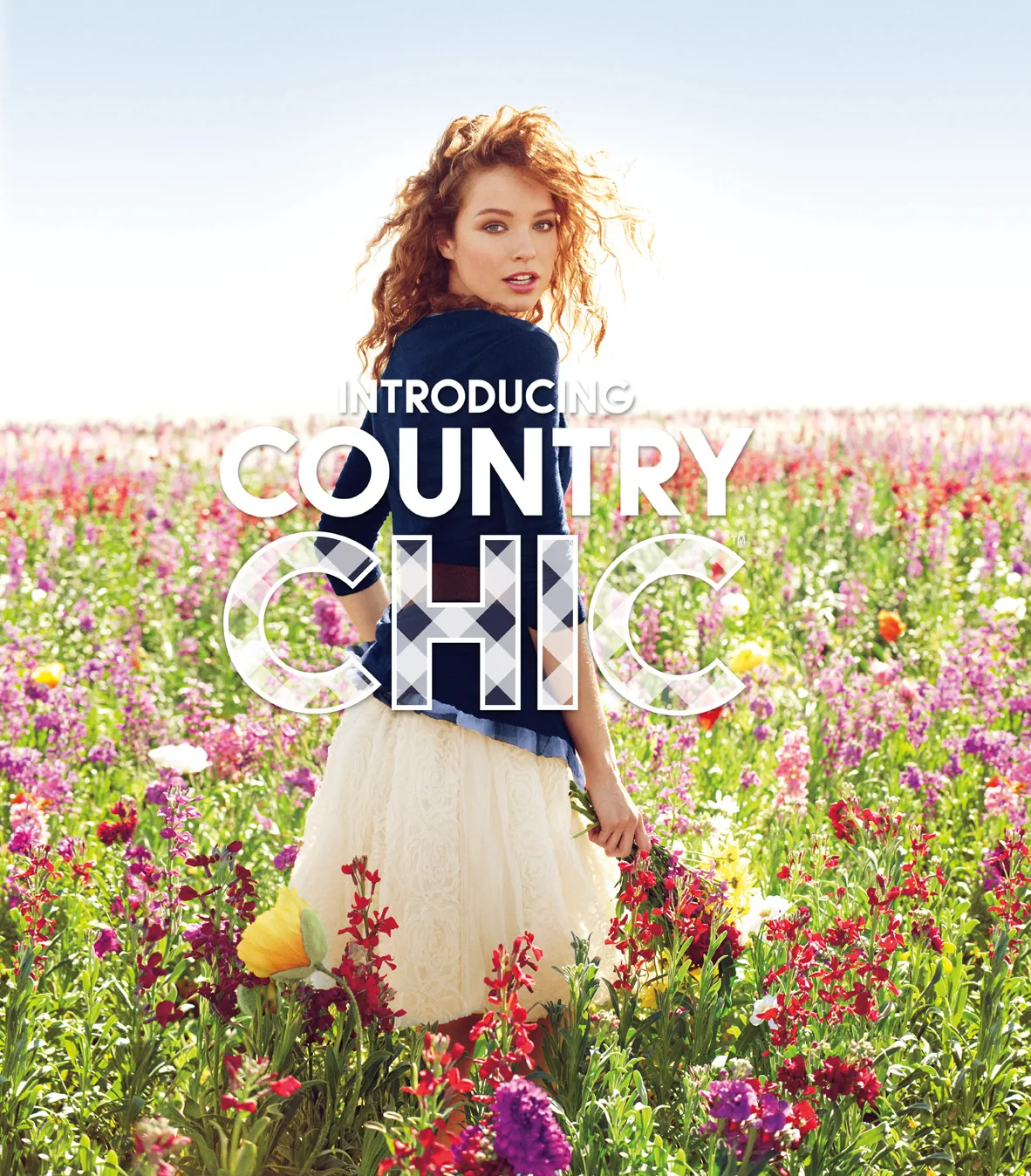 Campaign key art, a model in a field of wildflowers under a gingham-filled CHIC