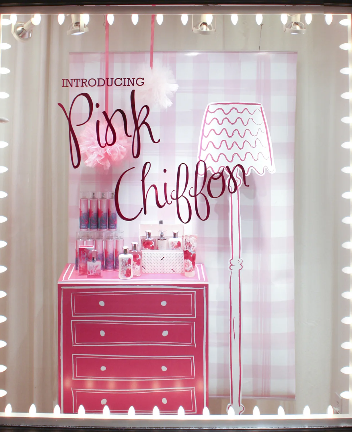 The launch window, a dresser and standard lamp drawn flat in pink marker behind real product