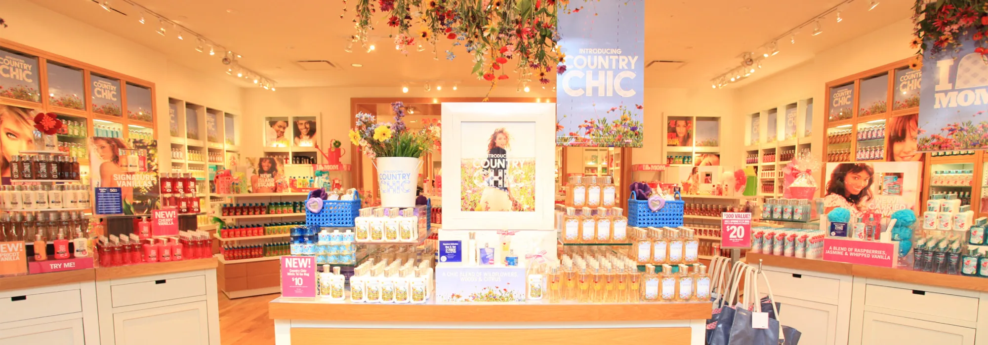 A store interior dressed for the Country Chic launch, wildflowers hanging over the centre table